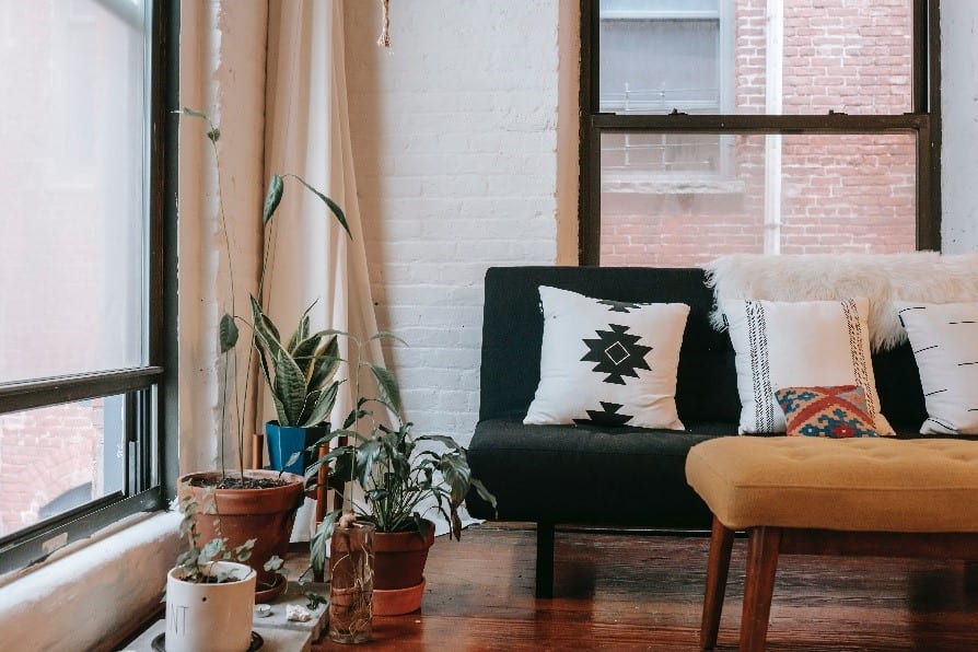 A living room is made all the more comfortable with a trendy white brick wall.