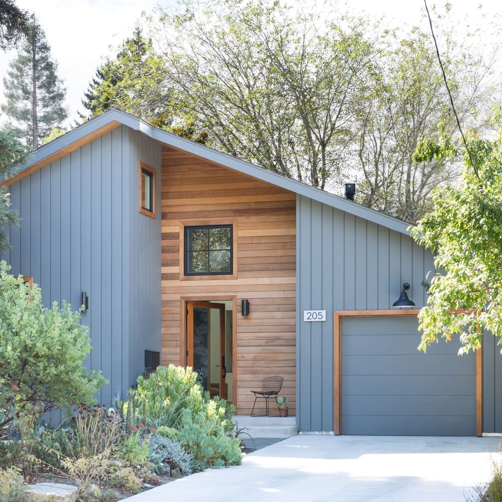 Grey blue house exterior with natural wood trim