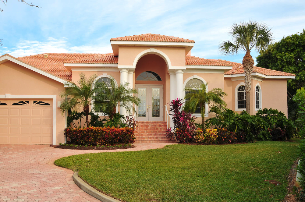 Mediterranean inspired estate with salmon exterior paint colours